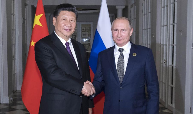 Xi, Putin exchange views on current int'l situation