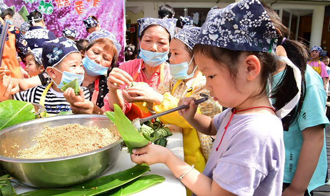 People make various kinds of Zongzi to celebrate upcoming Dragon Boat Festival