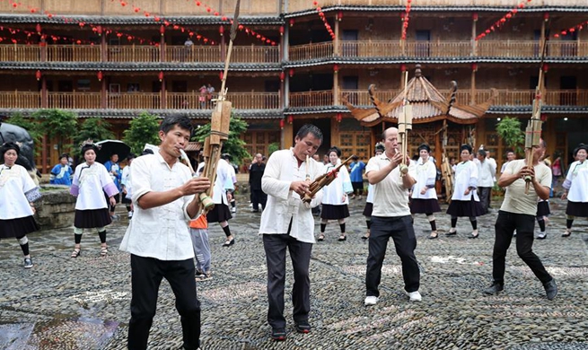 Local people of Dong ethnic group attend gathering to mark Xiangsi Festival in Guizhou